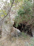 Большая пещера чуть дальше водовадов, по течению(правый берег)